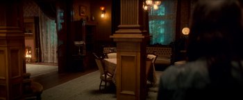 Movie still from “Scary Stories to Tell in the Dark” (2019), directed by André Øvredal – A dining room with a table , chairs , and a couch; Wide shot, High angle