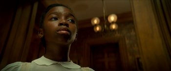 Movie still from “Scary Stories to Tell in the Dark” (2019), directed by André Øvredal – A person looking at the camera; Close Up shot, Low angle