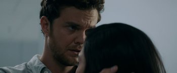 Movie still from “Scream” (2022), directed by Matt Bettinelli-Olpin – A person holding a woman's face; Close Up shot, Over the shoulder angle