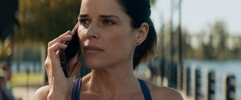 Movie still from “Scream” (2022), directed by Matt Bettinelli-Olpin – A person talking on a cell phone; Close Up shot, Low angle