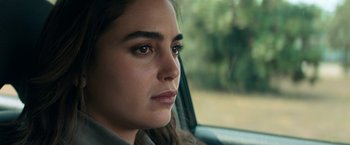 Movie still from “Scream” (2022), directed by Matt Bettinelli-Olpin – A person sitting in a car looking out the window; Close Up shot, Over the shoulder angle
