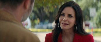 Movie still from “Scream” (2022), directed by Matt Bettinelli-Olpin – A person wearing a red jacket; Close Up shot, Over the shoulder angle