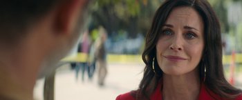 Movie still from “Scream” (2022), directed by Matt Bettinelli-Olpin – A person wearing a red jacket; Close Up shot, Over the shoulder angle