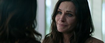 Movie still from “Scream” (2022), directed by Matt Bettinelli-Olpin – A person with blue eyes; Close Up shot, Over the shoulder angle