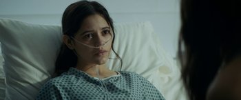 Movie still from “Scream” (2022), directed by Matt Bettinelli-Olpin – A woman in a hospital bed with a tube in her mouth; Close Up shot, High angle