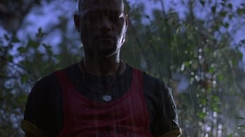 Movie still from “Searching for Bobby Fischer” (1993), directed by Steven Zaillian – A man in a red and black shirt standing in the rain; Close Up shot, Low angle