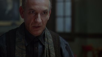 Movie still from “Searching for Bobby Fischer” (1993), directed by Steven Zaillian – A person wearing a shirt and a scarf; Close Up shot, Low angle