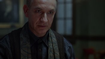 Movie still from “Searching for Bobby Fischer” (1993), directed by Steven Zaillian – A person wearing a scarf; Close Up shot, Over the shoulder angle