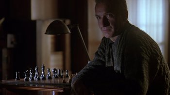 Movie still from “Searching for Bobby Fischer” (1993), directed by Steven Zaillian – A man sitting in front of a chessboard; Close Up shot, Over the shoulder angle