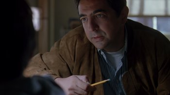 Movie still from “Searching for Bobby Fischer” (1993), directed by Steven Zaillian – A person holding a pencil; Close Up shot, Over the shoulder angle