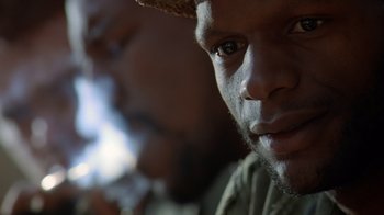 Movie still from “Searching for Bobby Fischer” (1993), directed by Steven Zaillian – A person wearing a hat; Close Up shot, Low angle