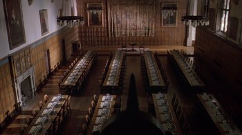 Movie still from “Searching for Bobby Fischer” (1993), directed by Steven Zaillian – A large dining hall with many tables and chairs; Extreme Wide shot, High angle