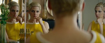 Movie still from “Seberg” (2019), directed by Benedict Andrews – A woman looking at her reflection in a mirror; Close Up shot, Over the shoulder angle