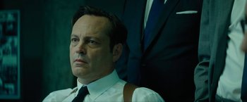 Movie still from “Seberg” (2019), directed by Benedict Andrews – A person wearing a suit and tie; Close Up shot, Low angle