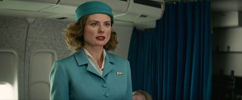 Movie still from “Seberg” (2019), directed by Benedict Andrews – A woman in a blue suit and a blue hat; Close Up shot, Low angle