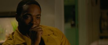 Movie still from “Seberg” (2019), directed by Benedict Andrews – A person with his hand on his chin; Close Up shot, Over the shoulder angle