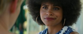 Movie still from “Seberg” (2019), directed by Benedict Andrews – A person with a large earring; Close Up shot, Over the shoulder angle