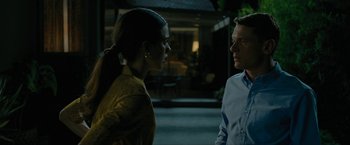 Movie still from “Seberg” (2019), directed by Benedict Andrews – A man and a woman standing next to each other on the street; Medium shot, Over the shoulder angle