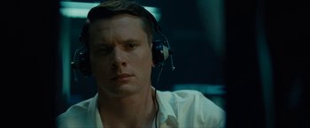 Movie still from “Seberg” (2019), directed by Benedict Andrews – A person wearing headphones; Close Up shot, Low angle