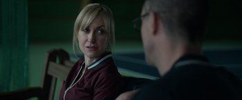 Movie still from “Official Secrets” (2019), directed by Gavin Hood – A woman sitting next to a man on a bench; Close Up shot, Over the shoulder angle