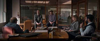 A group of people sitting around a table