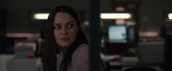 Movie still from “Official Secrets” (2019), directed by Gavin Hood – A woman sitting in front of a computer monitor; Close Up shot, Over the shoulder angle