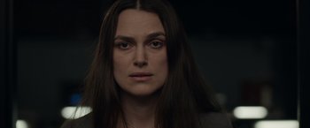 Movie still from “Official Secrets” (2019), directed by Gavin Hood – A person with long brown hair; Close Up shot, High angle