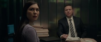 Movie still from “Official Secrets” (2019), directed by Gavin Hood – A woman and a man sitting in front of each other in a room; Close Up shot, Over the shoulder angle