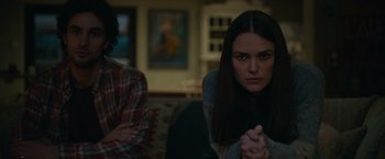 Movie still from “Official Secrets” (2019), directed by Gavin Hood – A woman sitting next to another woman in a room; Medium shot, Over the shoulder angle