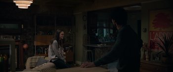 Movie still from “Official Secrets” (2019), directed by Gavin Hood – Two people sitting at a table in a room; Wide shot, Over the shoulder angle