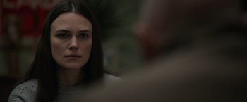 Movie still from “Official Secrets” (2019), directed by Gavin Hood – A person with long hair; Close Up shot, Over the shoulder angle