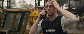A man holding a cell phone up to his head