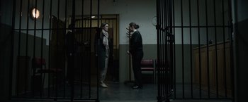 Movie still from “Official Secrets” (2019), directed by Gavin Hood – Two women standing in front of each other in a room; Wide shot, Low angle