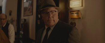 Movie still from “Selma” (2014), directed by Ava DuVernay – An older man wearing a hat and glasses; Close Up shot, Low angle