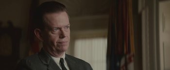 Movie still from “Selma” (2014), directed by Ava DuVernay – A person wearing a suit and tie; Close Up shot, Low angle