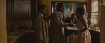 Movie still from “Selma” (2014), directed by Ava DuVernay – Two men standing next to each other in a room; Medium shot, Over the shoulder angle