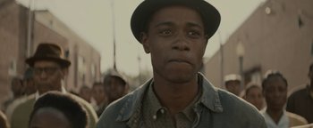 Movie still from “Selma” (2014), directed by Ava DuVernay – A person wearing a hat; Close Up shot, Over the shoulder angle