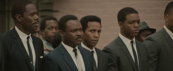 Movie still from “Selma” (2014), directed by Ava DuVernay – A group of men standing next to each other wearing suits and ties; Close Up shot, Over the shoulder angle
