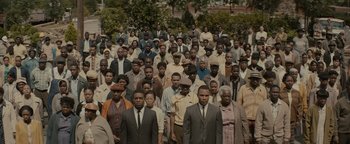 Movie still from “Selma” (2014), directed by Ava DuVernay – A large group of men standing in a line; Extreme Wide shot, High angle