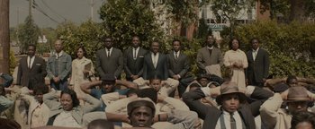 Movie still from “Selma” (2014), directed by Ava DuVernay – A group of men in suits and ties posing for a picture; Wide shot, High angle