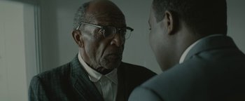 Movie still from “Selma” (2014), directed by Ava DuVernay – An older man wearing glasses looking at a younger man; Close Up shot, Over the shoulder angle