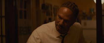 Movie still from “Selma” (2014), directed by Ava DuVernay – A man wearing a white shirt and a black tie; Close Up shot, Over the shoulder angle