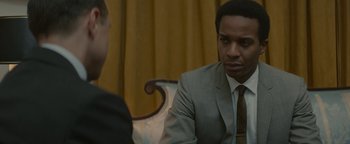 Movie still from “Selma” (2014), directed by Ava DuVernay – A man wearing a suit and tie talking to another man in a suit; Close Up shot, Over the shoulder angle