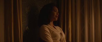 Movie still from “Selma” (2014), directed by Ava DuVernay – A woman sitting in front of a window with her eyes closed; Medium shot, Over the shoulder angle