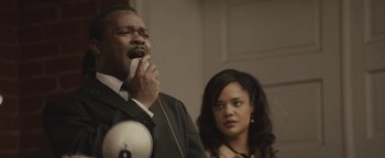 Movie still from “Selma” (2014), directed by Ava DuVernay – A man and a woman standing next to each other; Medium shot, Low angle