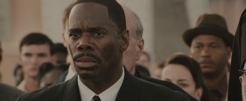 Movie still from “Selma” (2014), directed by Ava DuVernay – A man in a suit and a tie; Close Up shot, Over the shoulder angle