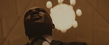 Movie still from “Selma” (2014), directed by Ava DuVernay – A person wearing a suit and tie; Close Up shot, Low angle