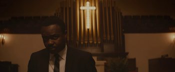 Movie still from “Selma” (2014), directed by Ava DuVernay – A man standing in front of an organ in a church; Close Up shot, Low angle