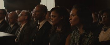 Movie still from “Selma” (2014), directed by Ava DuVernay – A group of people standing next to each other in a room; Medium shot, High angle