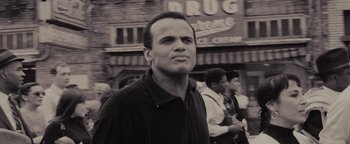 Movie still from “Selma” (2014), directed by Ava DuVernay – A black and white photo of a man standing in front of a crowd; Close Up shot, Low angle